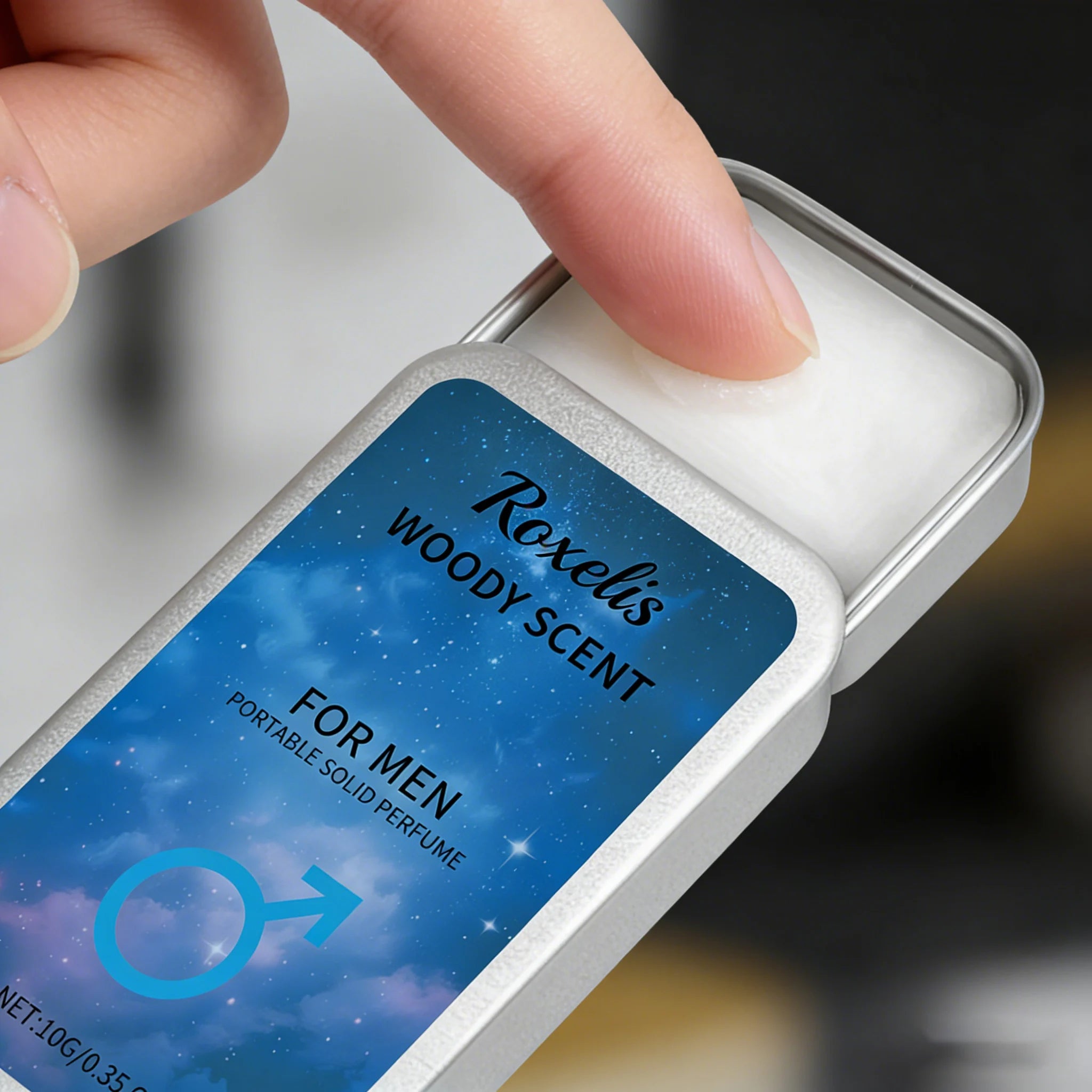 Roxelis woody solid perfume for men. Portable rectangular metal tin, natural long-lasting fragrance balm pocket scent.