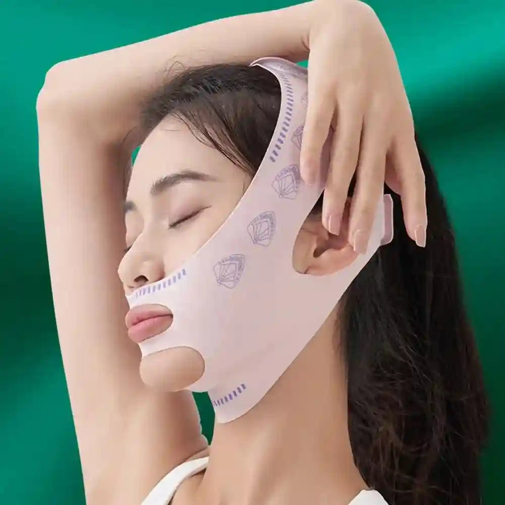 A woman wears a light pink, smooth face-lifting bandage with small purple fan patterns against a green background.