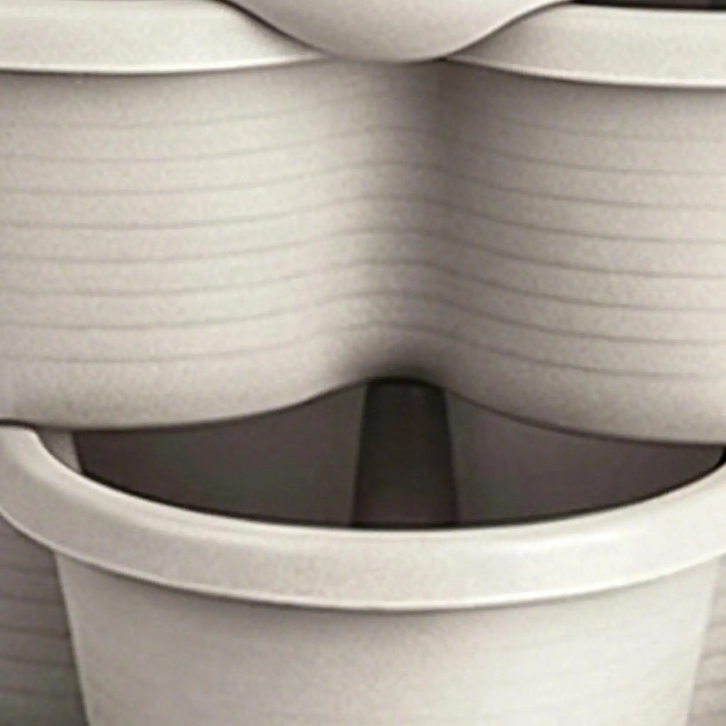 White butterfly-shaped stackable planter pot with interlocking rim close-up