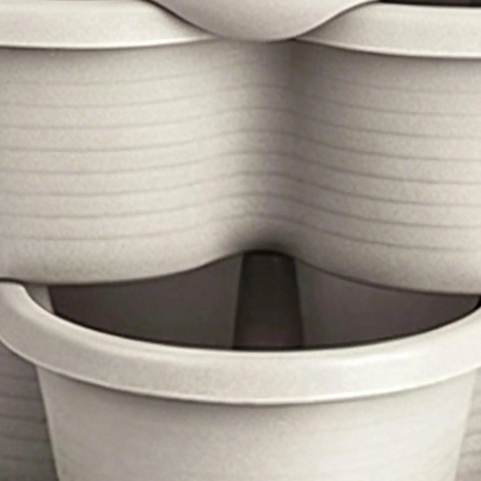 White butterfly-shaped stackable planter pot with interlocking rim close-up