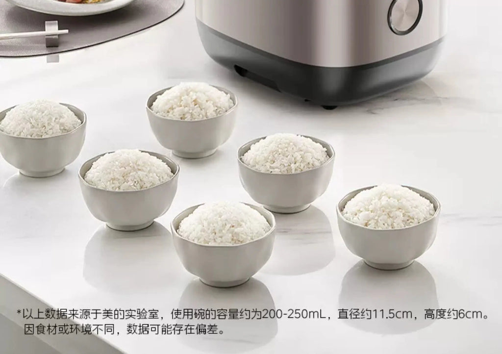 Rice cooker serving rice in multiple white bowls