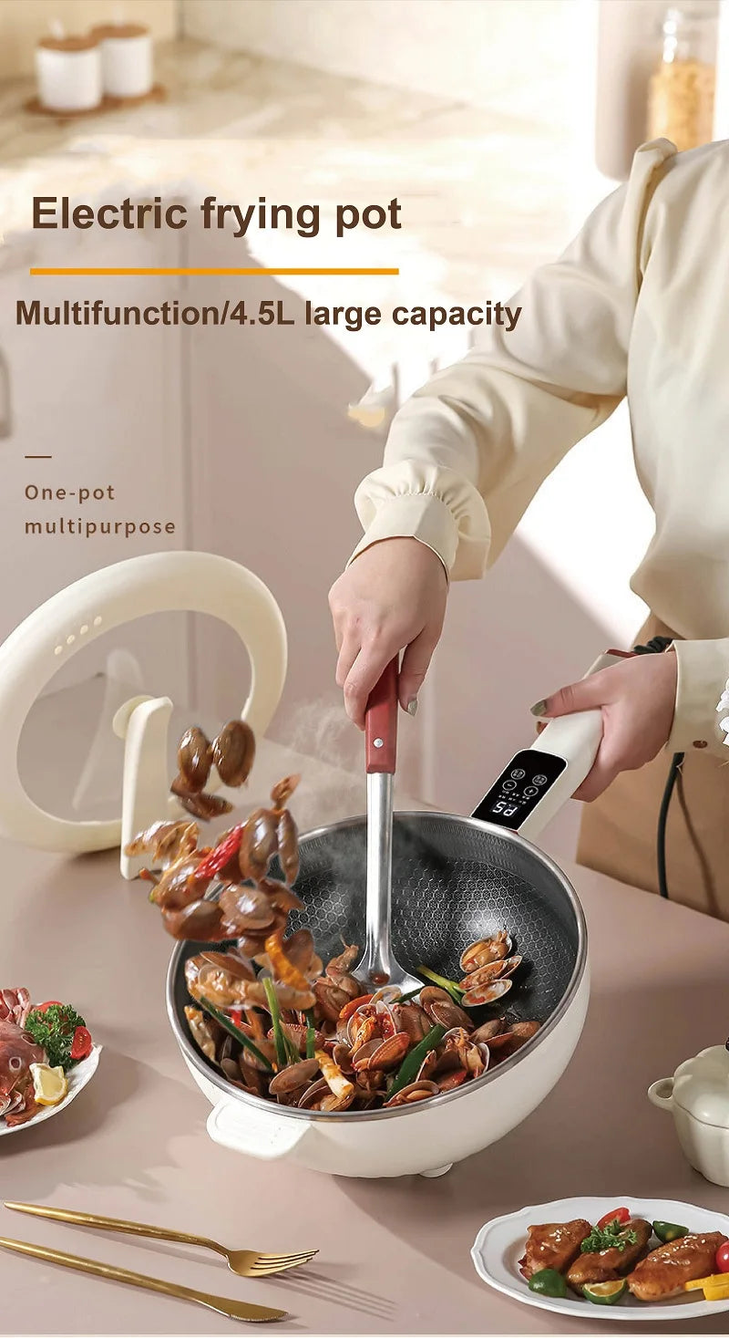 Electric frying pot with lid, 4.5L capacity, dark nonstick bowl filled with cooked ingredients