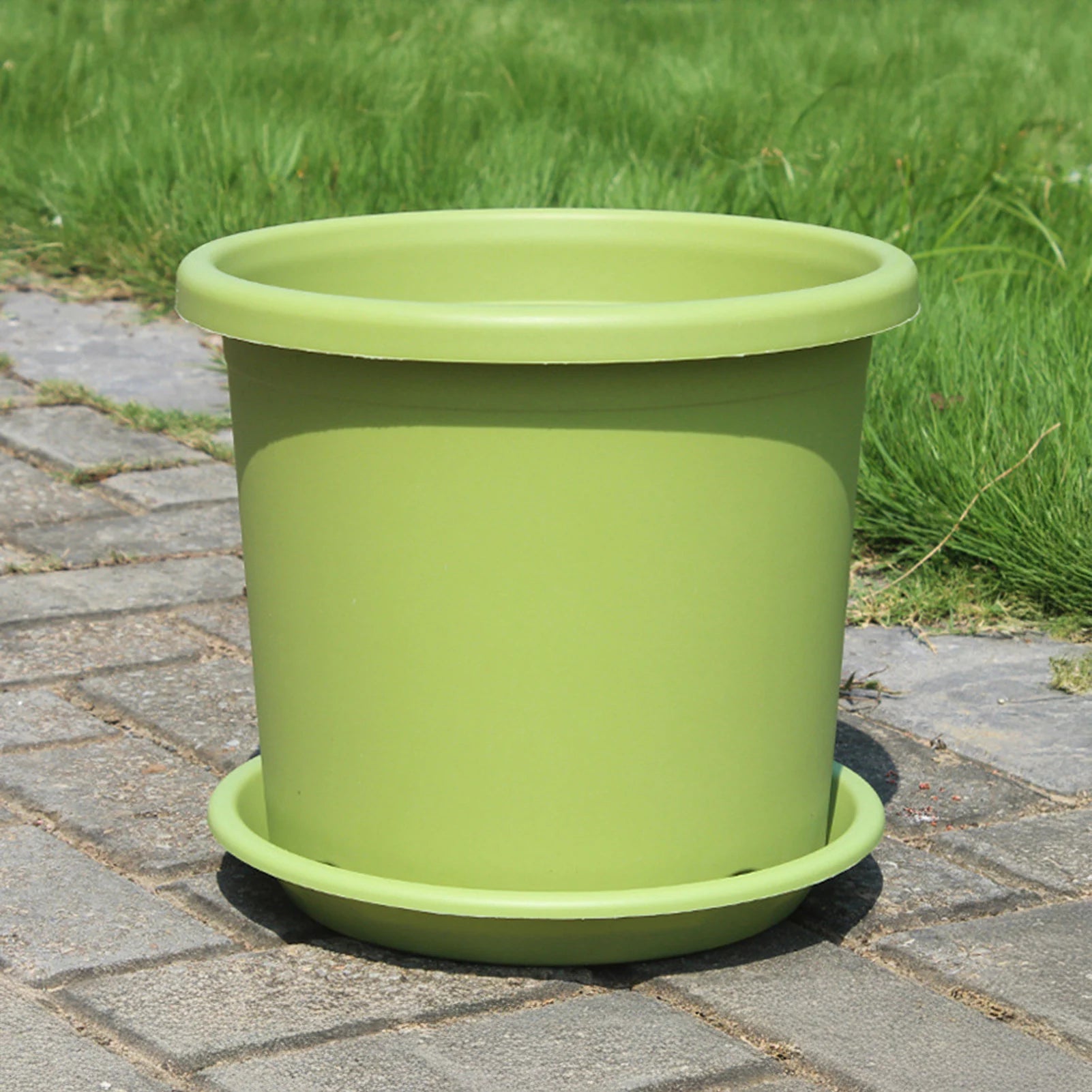 Light green thick plastic self-watering flowerpot with wide top rim and tray