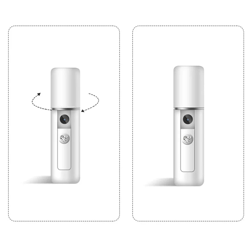 Two white, cylindrical portable facial misters with a heart-shaped button and a central nozzle on a white background.