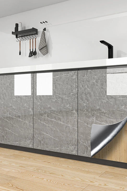 Gray marble-look waterproof self-adhesive cabinet wallpaper sample on wall with tools hook