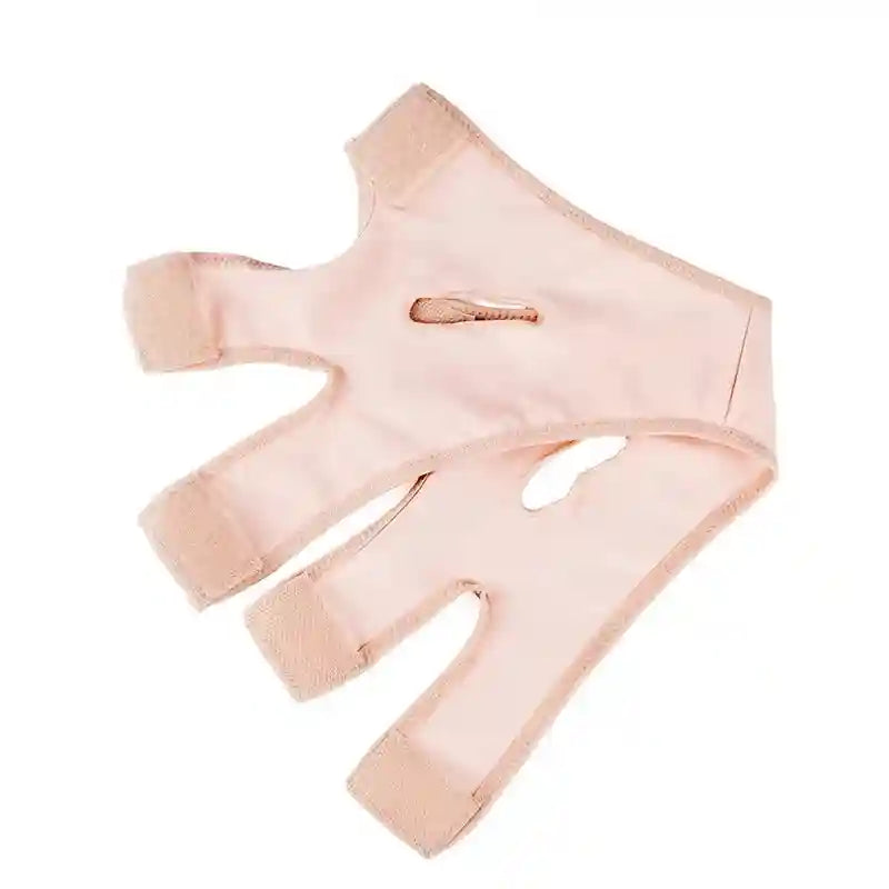 Light pink elastic V-line face slimming bandage with adjustable Velcro straps and ear cutouts on a white background.