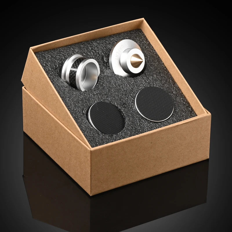 Speaker shock-absorbing foot pads in open box: silver bases with copper center tips