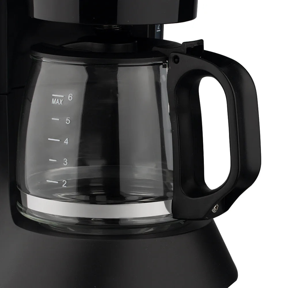 Black 6-cup drip coffee maker with glass carafe and measuring water level marks for precise brewing.