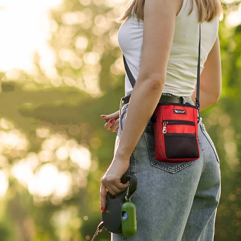 Red nylon pet treat training pouch waist bag for easy puppy obedience and snack feeding on walks.