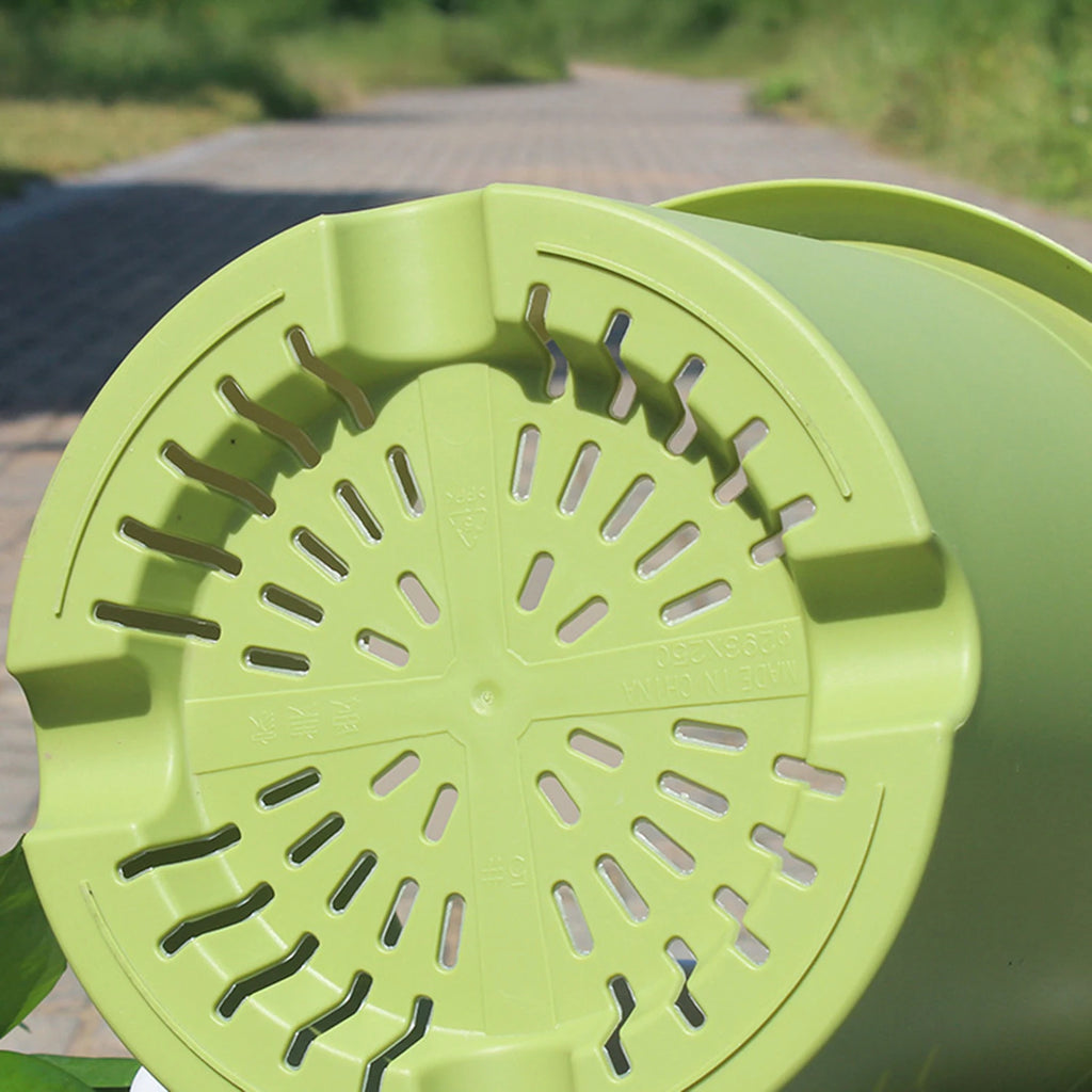 Lime green thick plastic self-watering flowerpot lid-like base with drainage holes