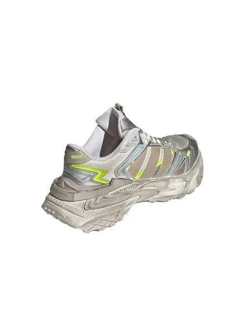 Adidas XLG Storm Edge dad sneakers in silver, brown, and white with neon yellow accents and shock-absorbing soles.