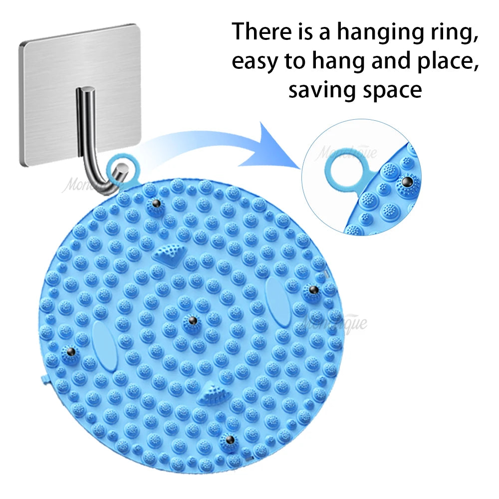 Blue circular foot massage acupressure mat with hanging ring for easy wall storage and foot reflexology pain relief.