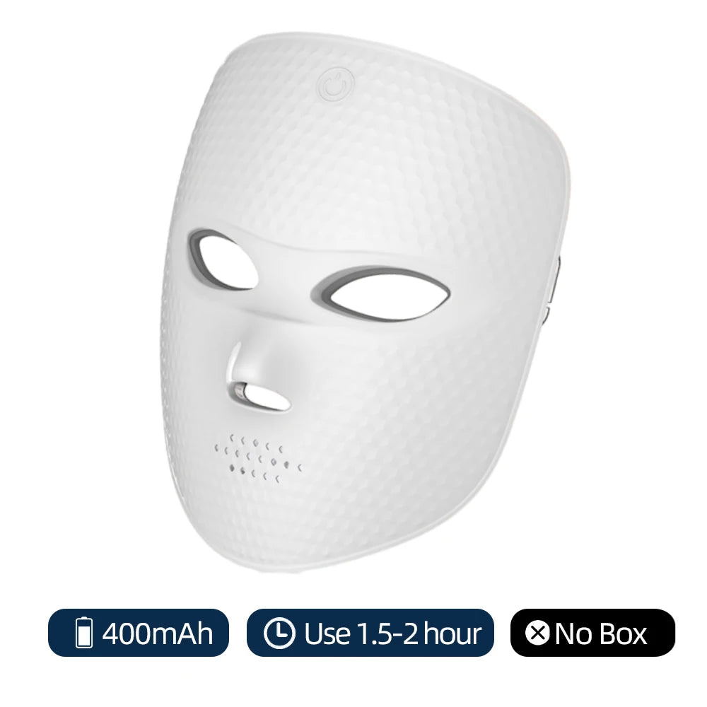 White wireless LED facial mask with a textured honeycomb surface, eye and nose cutouts, and a power button on top.