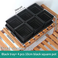 Black drainage tray with four ribbed square succulent pots, raised square compartments