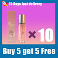 Ten 10ml cylindrical glass vials of pink women's glamour perfume with silver caps and matching boxes.