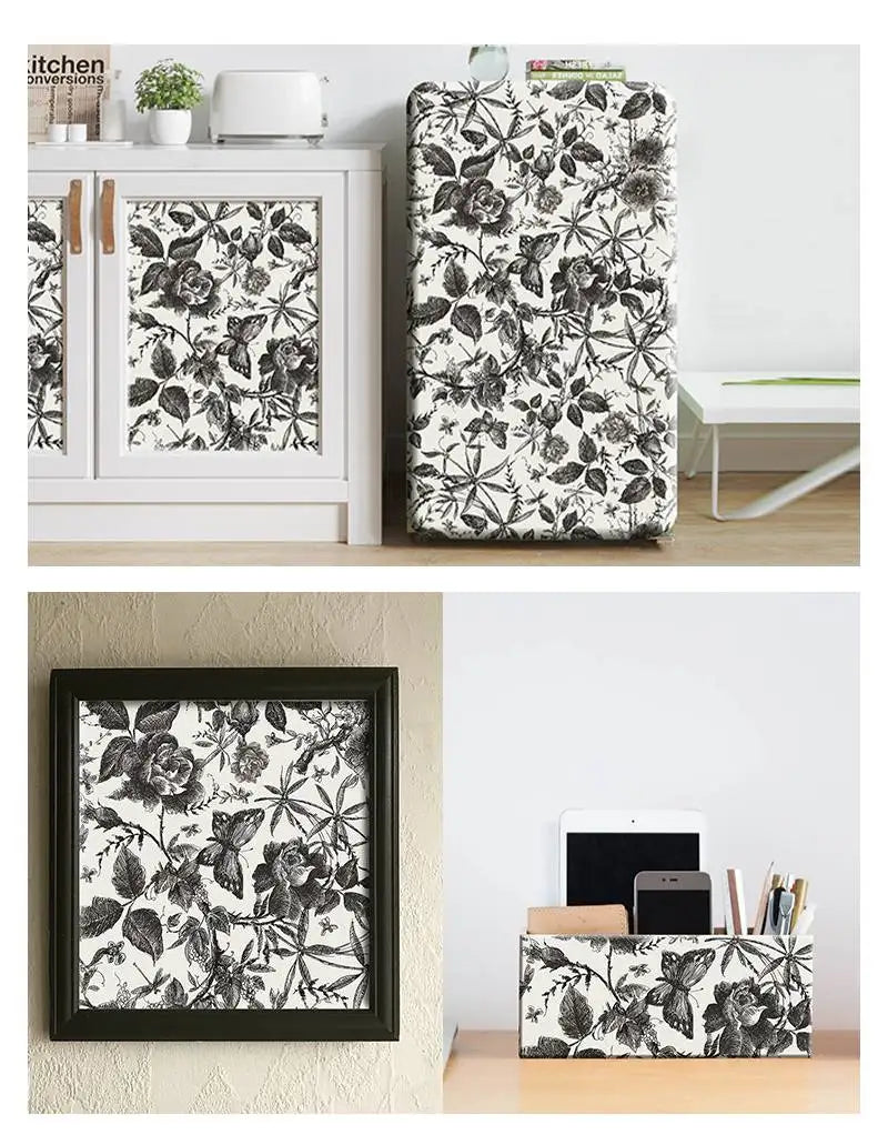 Black-and-white floral wallpaper applied on cabinet fronts and small framed decor squares
