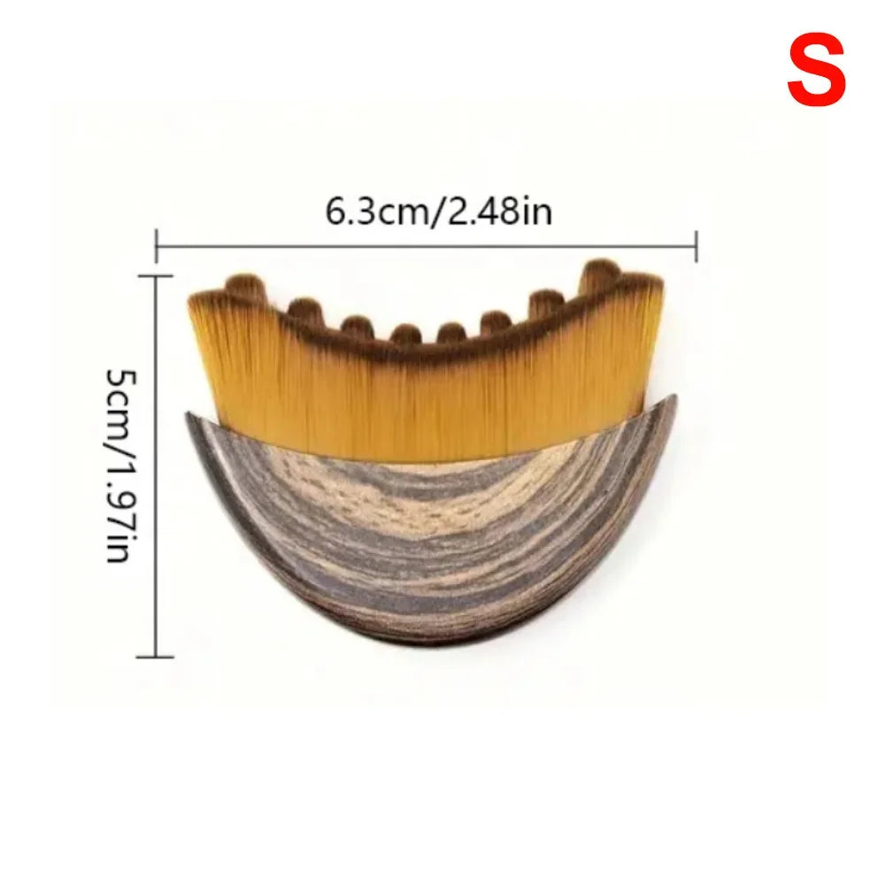 Crescent-shaped facial massage brush with wood-grain handle and dense yellow bristles, labeled with size dimensions.