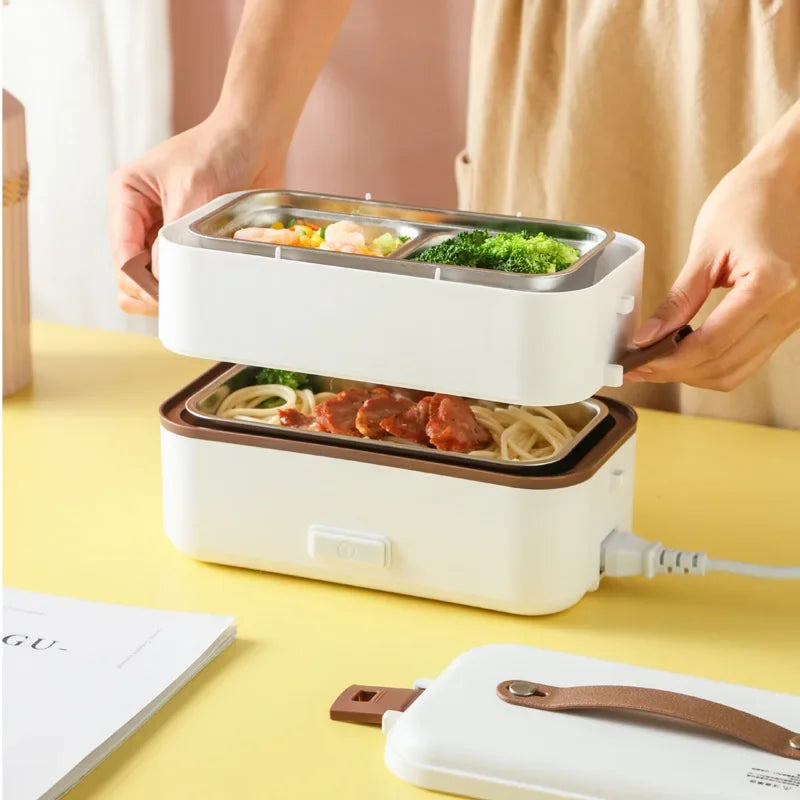 Portable electric heating lunch box with lid open, holding stainless meal trays.