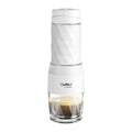 Biolomix CoffArt white portable manual espresso coffee maker with textured geometric design and glass base.