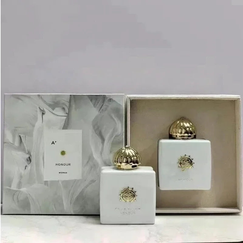 Amouage Honour Woman EDP: White square luxury perfume bottle with gold dome cap and box, floral oriental fragrance.