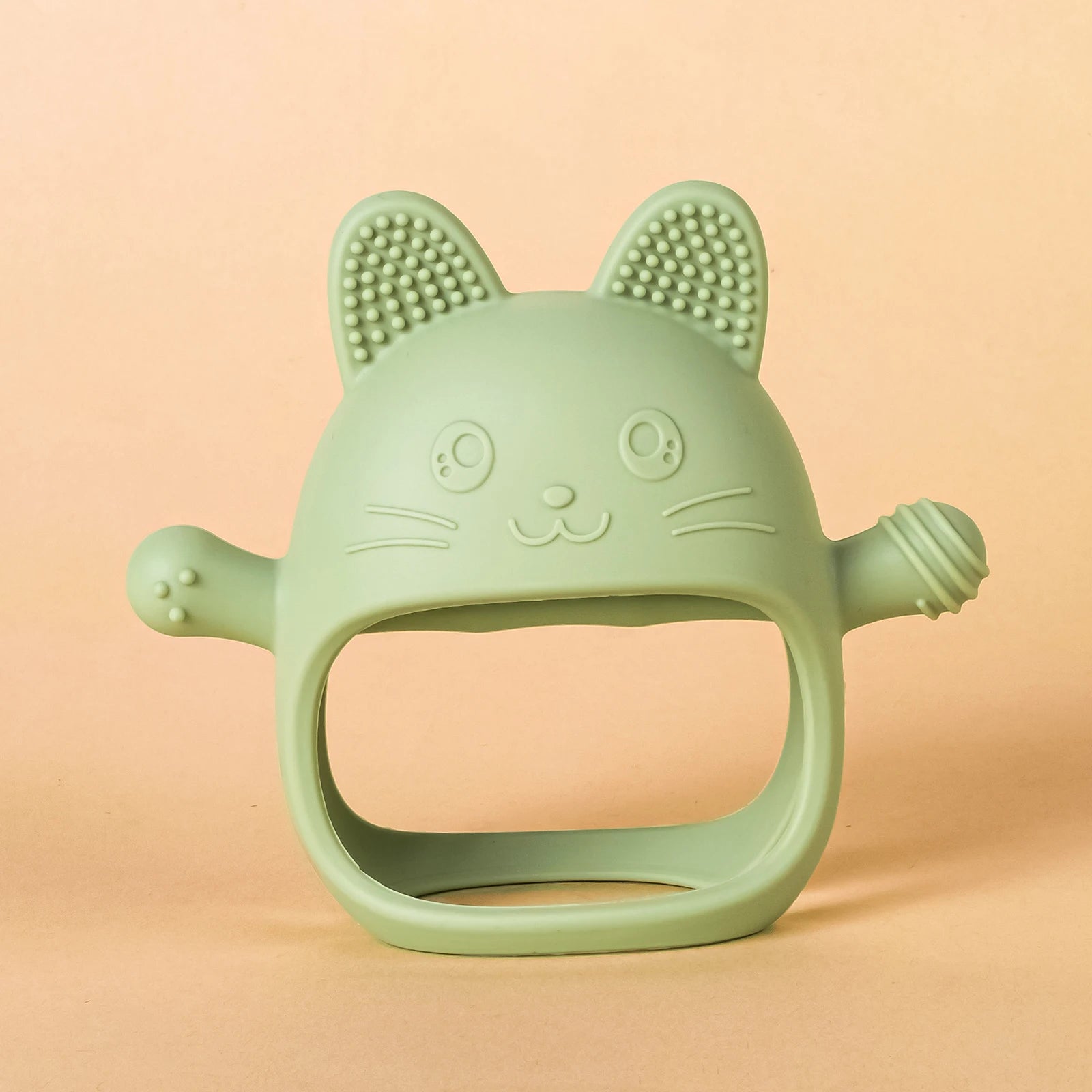 Sage green cat-shaped silicone baby teething toy for soothing sore gums.