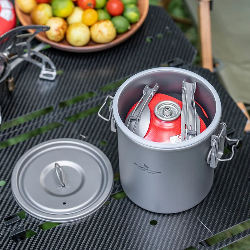 Titanium camping rice cooker set with inner red pot, outer pot, and flat lid
