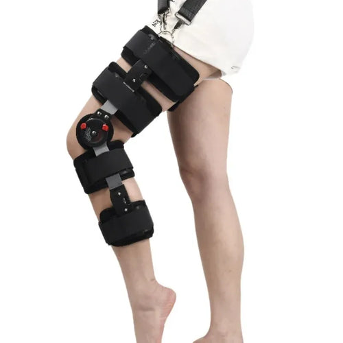 Black adjustable orthopedic knee brace for ligament recovery and pain relief with hinged metal support and straps.