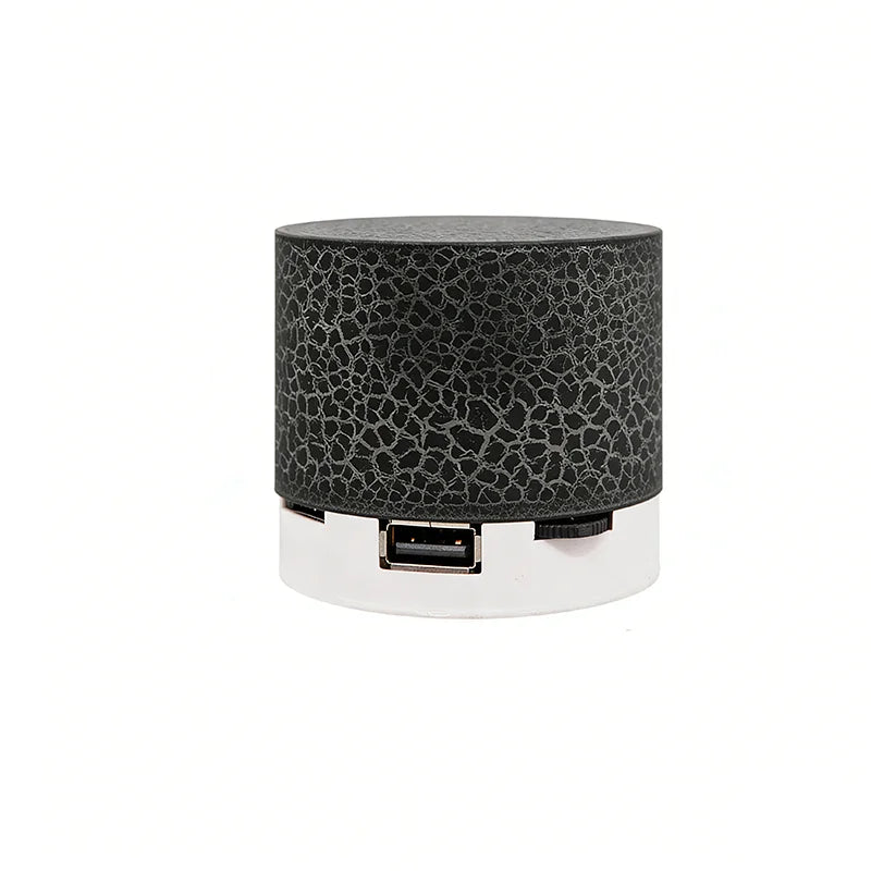 Portable wireless Bluetooth speaker, dark gray cylinder with USB port and strap control area