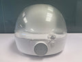 Tidesmit automatic cap cleaner featuring steam cleaning, ironing, and drying for baseball caps and bucket hats.