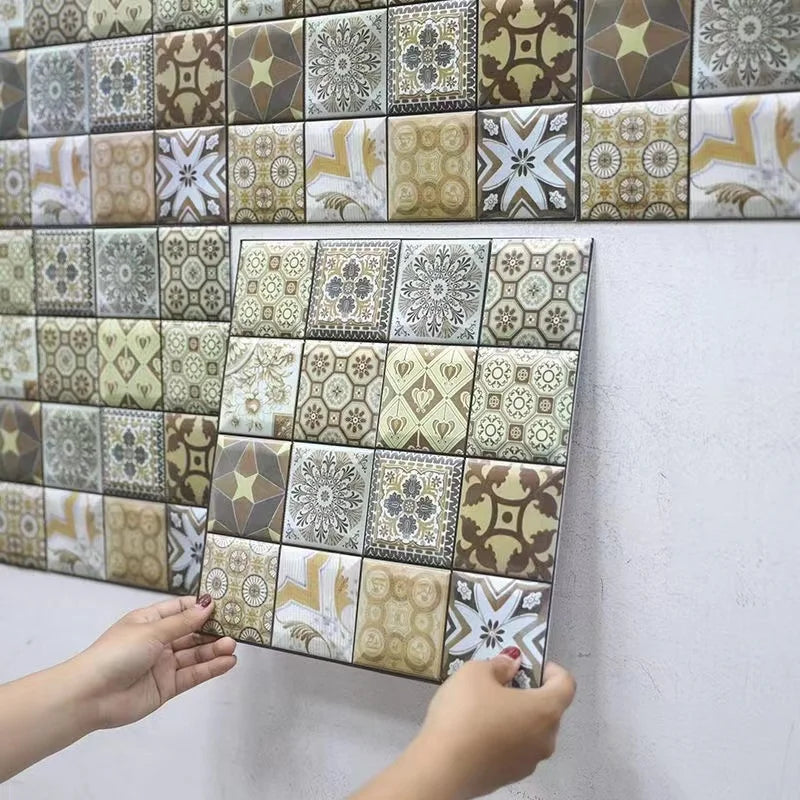 Peel-and-stick backsplash tile squares with mixed green, gray, and beige geometric prints