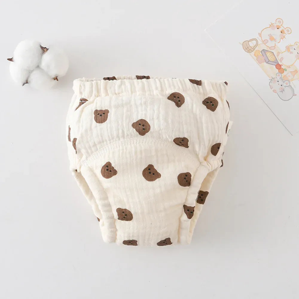 Soft cotton baby training diaper with cute brown bear print design for potty training toddlers.