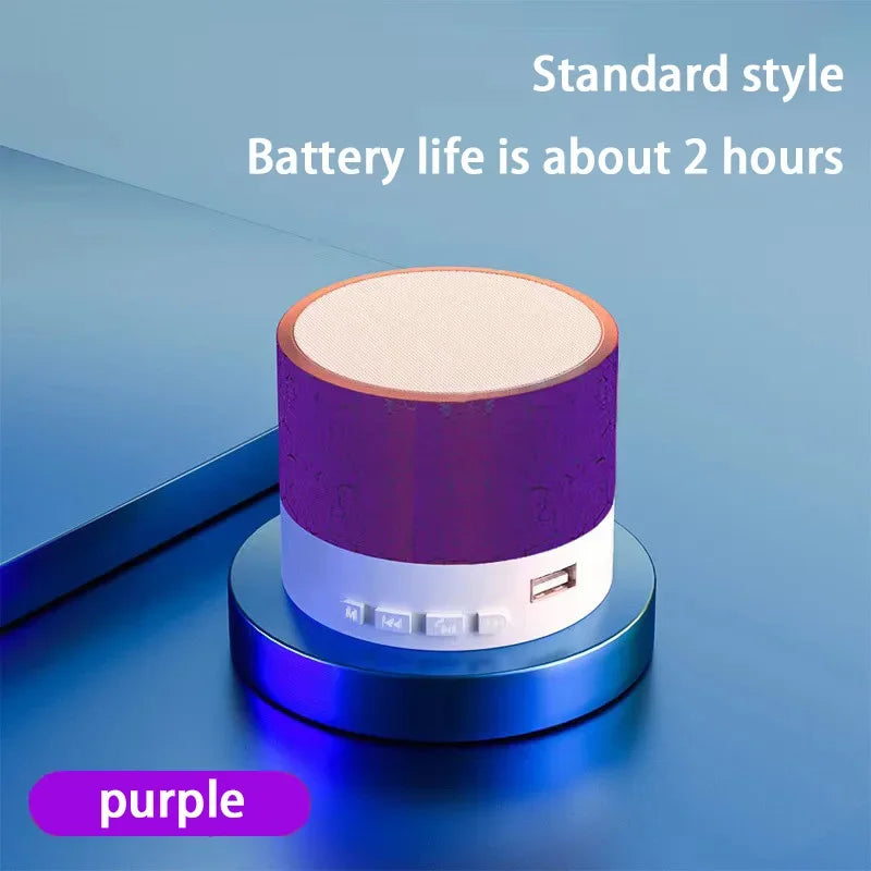 Portable Bluetooth speaker with purple textured body and beige top panel
