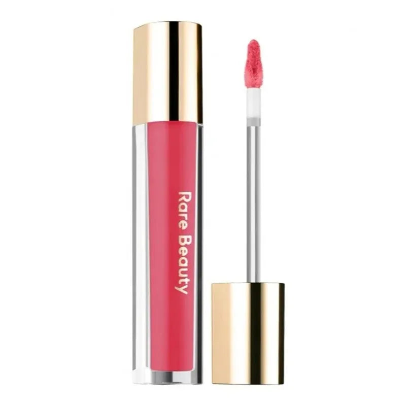 Rare Beauty Soft Pinch Tinted Lip Oil in a vibrant pink shade with a gold cap and doe-foot applicator.