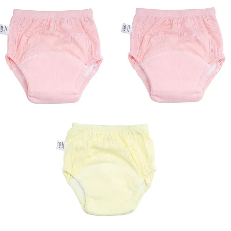 Three-pack of UoU baby potty training pants in pink and yellow for comfortable baby care.