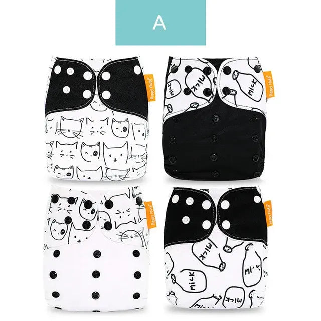 Four Happy Flute reusable cloth diapers with black and white cat and milk bottle patterns. Baby care essentials.
