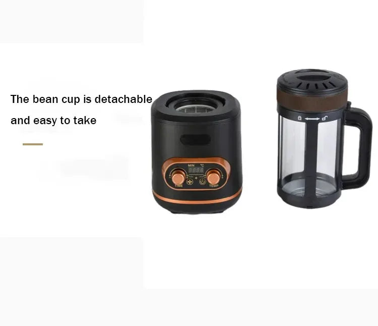 Black electric coffee bean roaster with digital display, copper knobs, and a detachable clear glass bean cup.