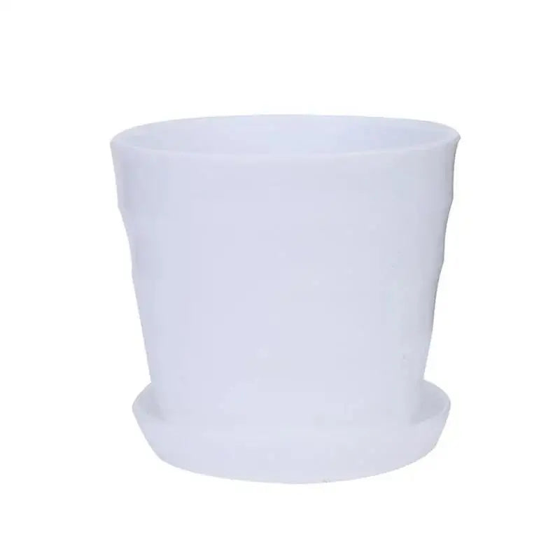 White plastic flower pot with matching saucer, round cup shape