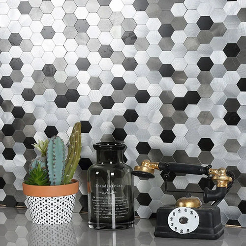 Hexagon peel-and-stick tile sheet with silver and dark gray black pattern