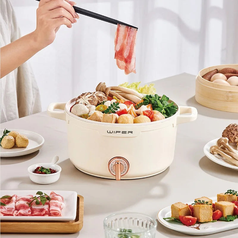 2.2L double-layer bamboo steamer electric cooking pot holding an assortment of food, lid on