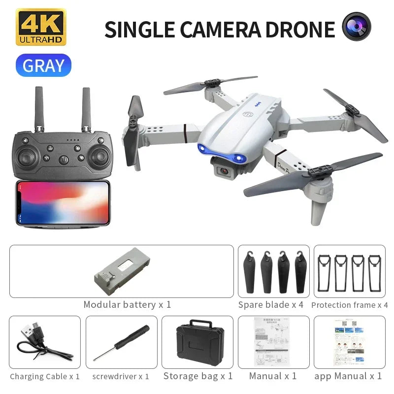 Gray 4K single-camera drone with controller, spare blades, guards, battery, cables, and storage case.