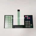 Scale keypad film assembly with numeric keypad, function keys, and center ribbon cable