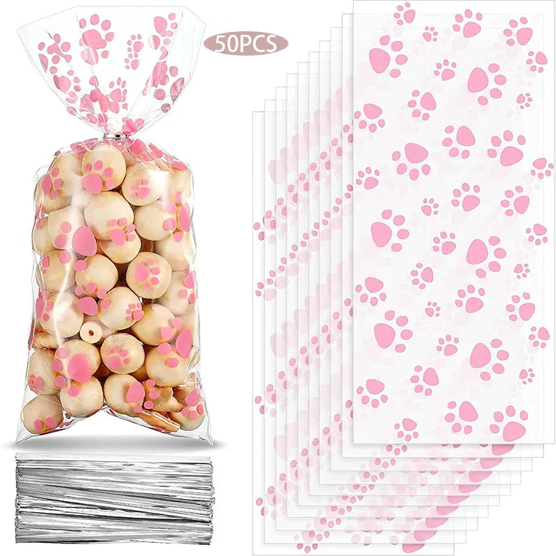50 pack of clear cellophane bags with pink paw prints for dog or cat birthday party favors and treat packaging.