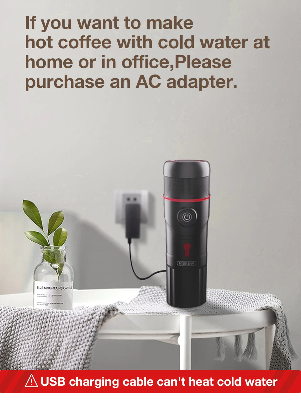 HiBREW portable black coffee maker with red trim, USB powered, on a table, requiring an AC adapter for hot water.