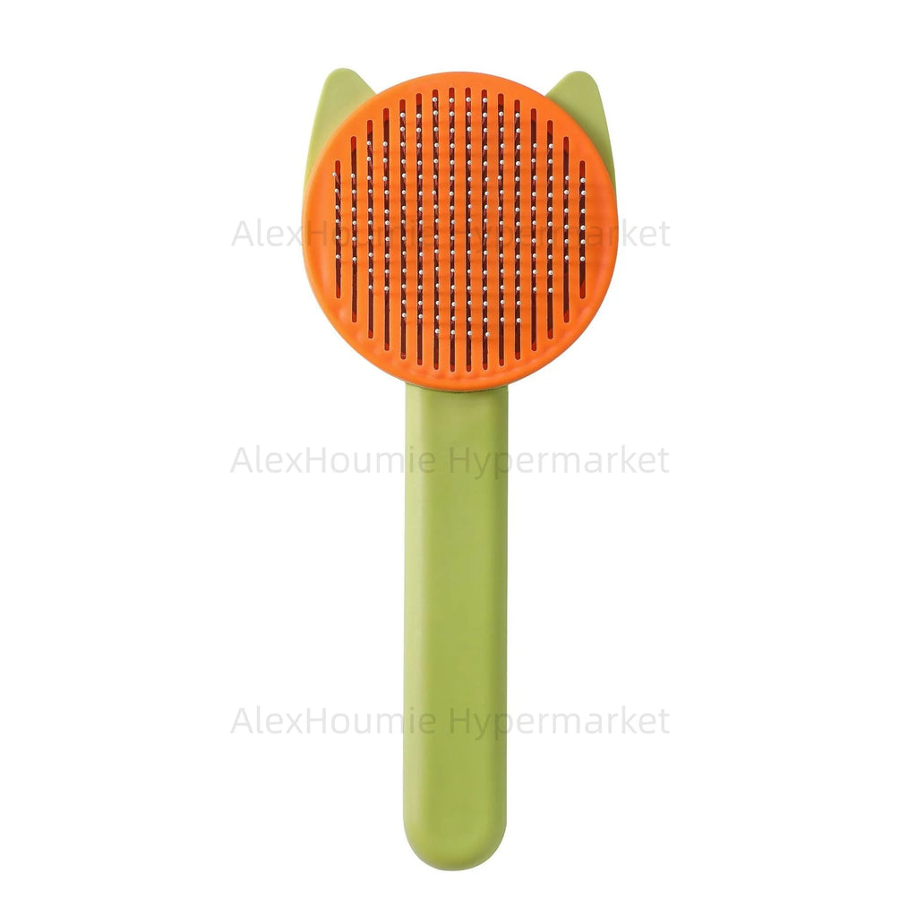 Orange and green cat grooming brush for removing loose pet hair and detangling fur in cats and puppies.