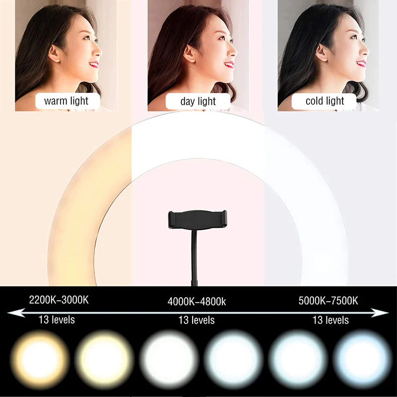 White circular LED ring light with a central phone mount, featuring adjustable color temperature and brightness