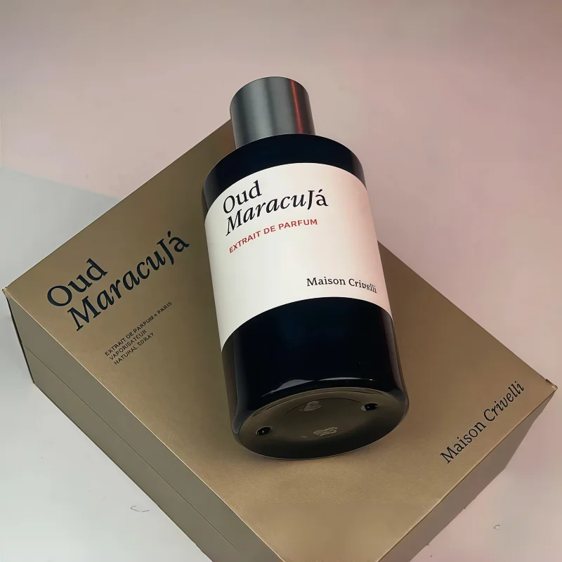 Maison Crivelli Oud Maracuja Extrait de Parfum unisex fragrance, luxury round black bottle with gold presentation box.