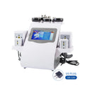 White 6-in-1 body slimming machine with touch screen, various applicator heads, and laser pads on white background.