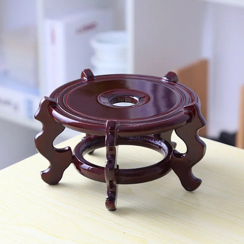 Dark wooden flowerpot base stand riser with circular top ring and three curved legs