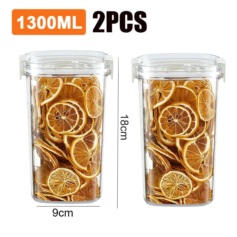 Two clear vacuum jars with sealed lids filled with dried orange slices