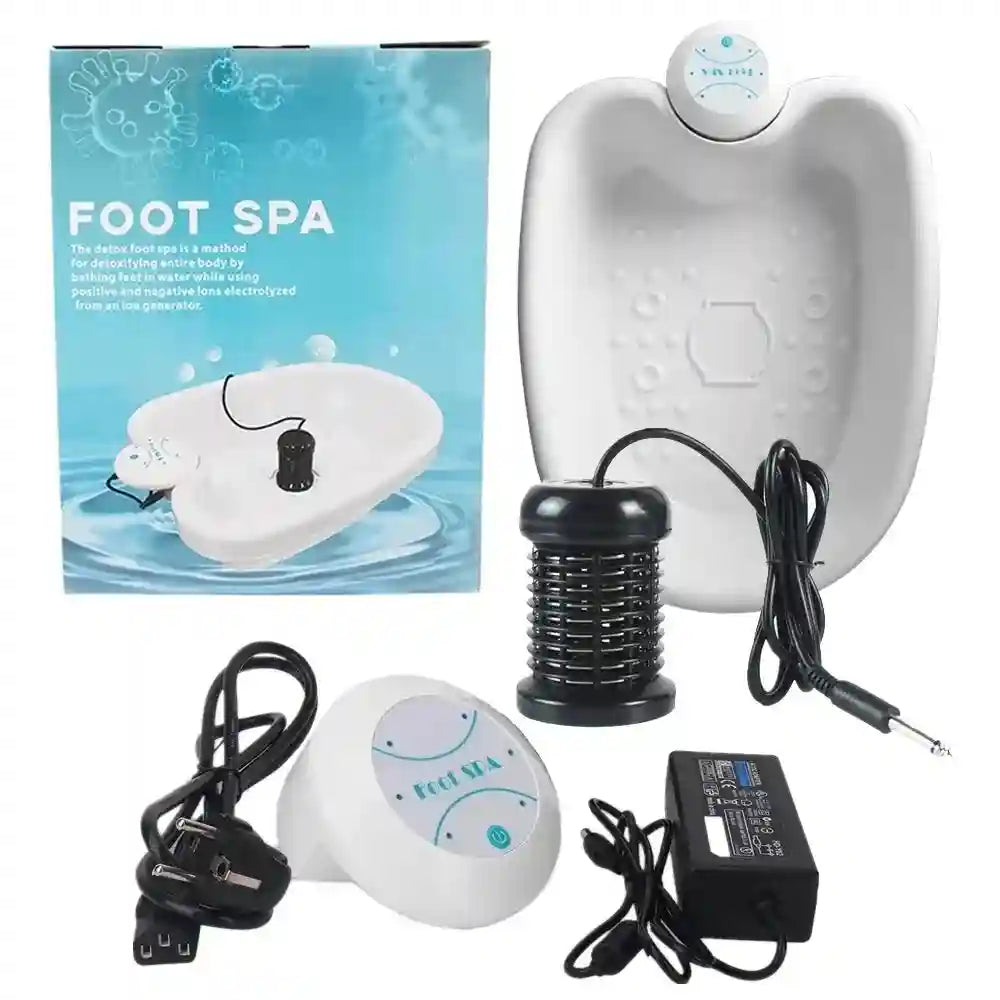White ionic detox foot spa bath machine with electric array, control unit, and power adapter in product packaging.